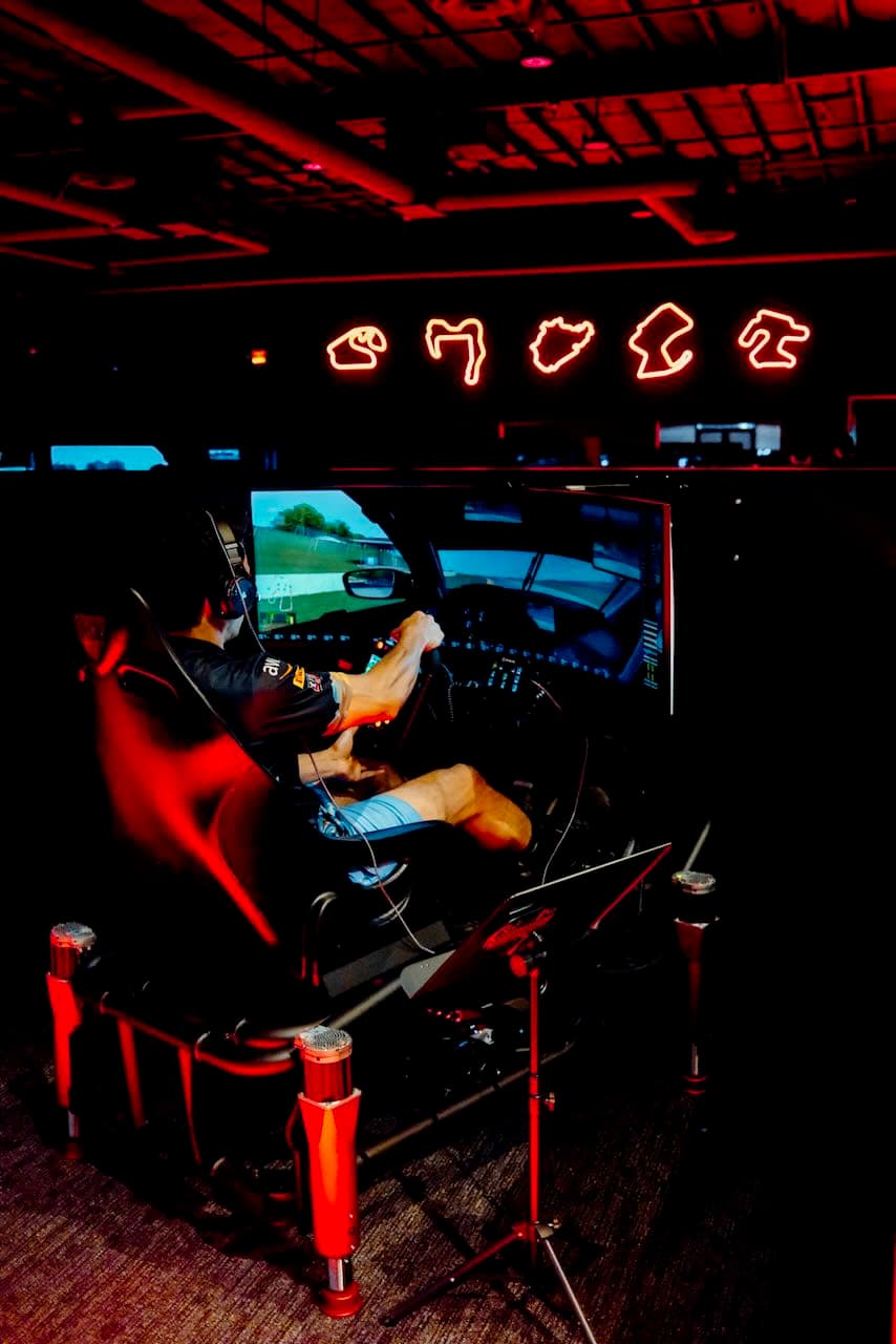 eSports sim rig with a 3-axis motion base and a widescreen