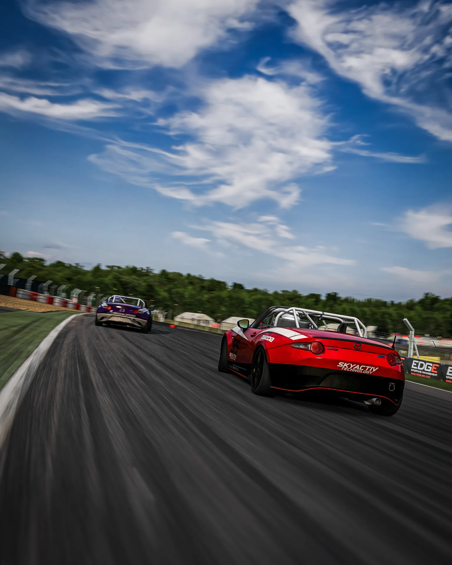 Two identical MX-5 Cup cars racing nose to tail at Brands Hatch, in the sim