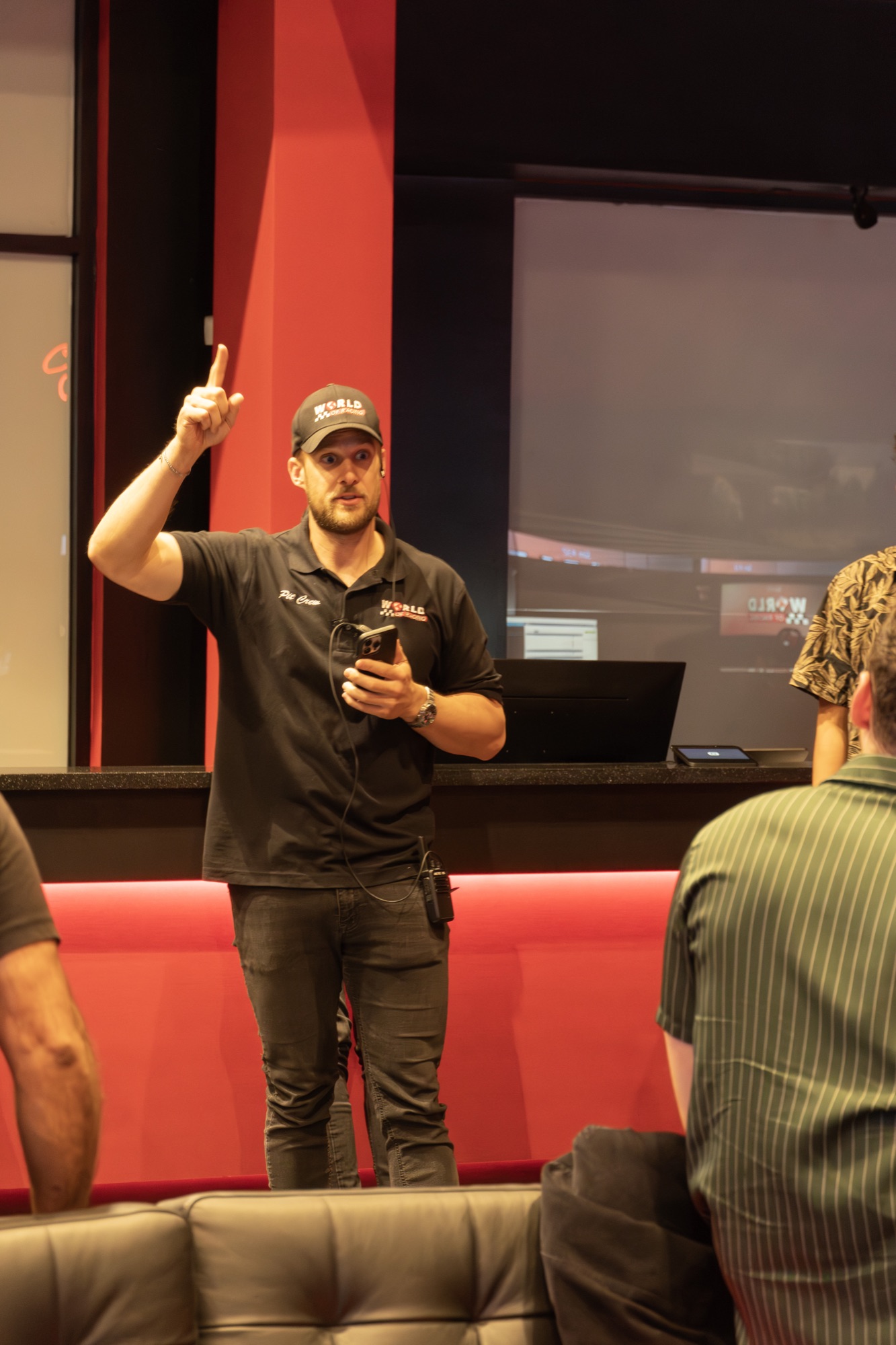 WOR coach giving a pre-race briefing in the Tustin lounge