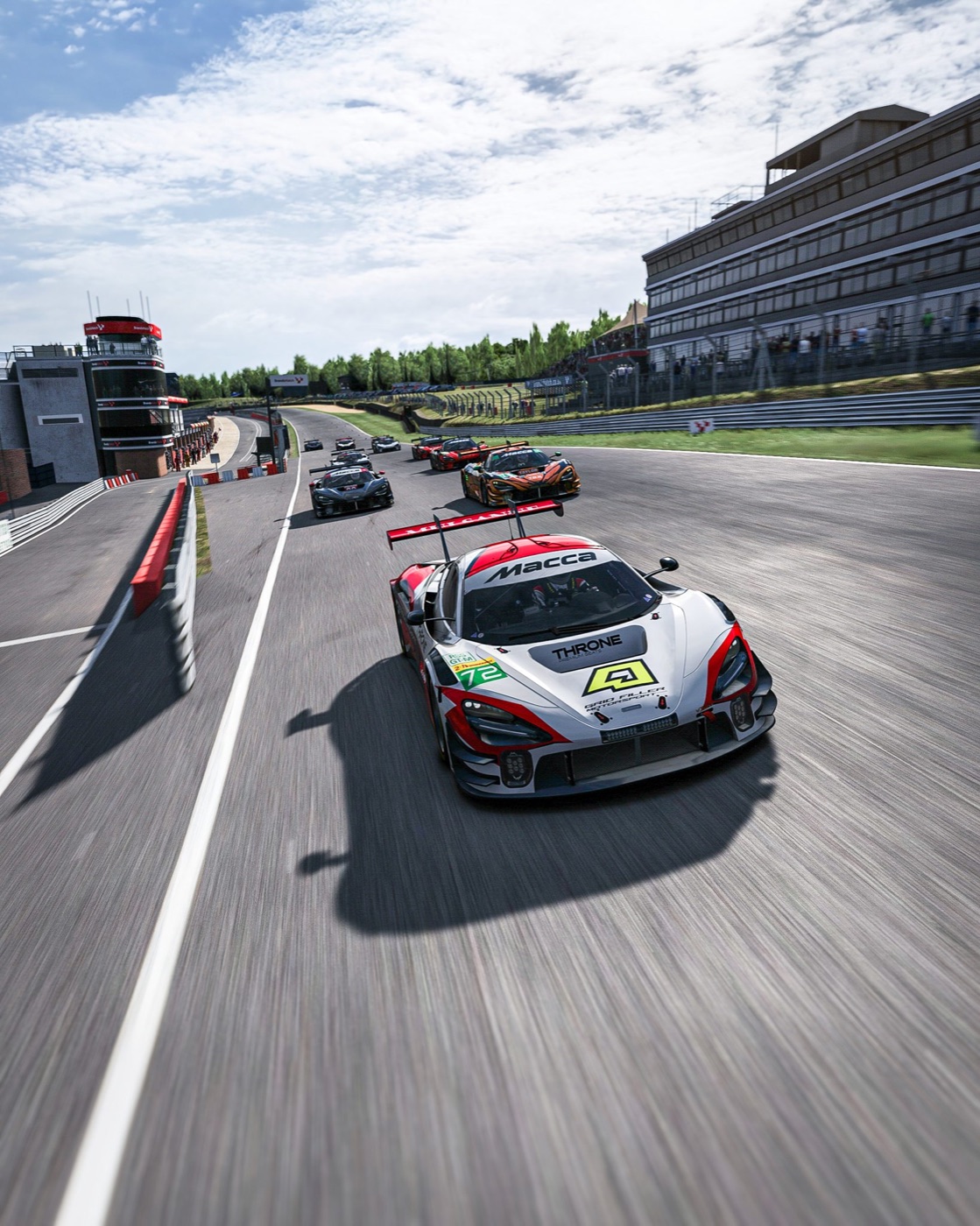 A full field of race cars wheel-to-wheel on one track, WOR-livery McLaren leading